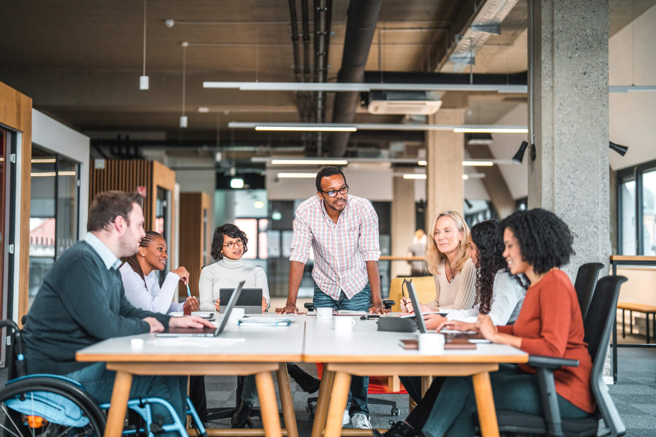 Diverse group of people sitting around a table in an office