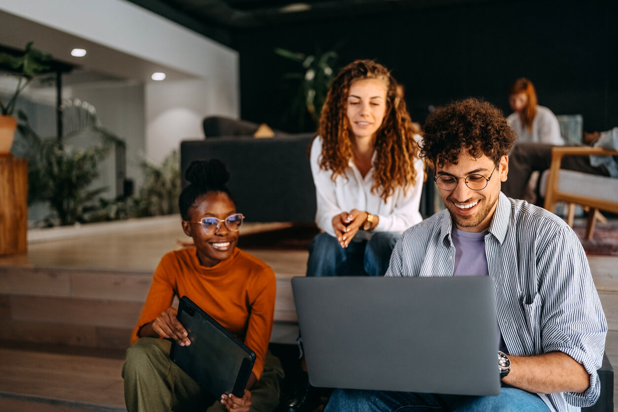 Group of Gen Z journalists working in an office
