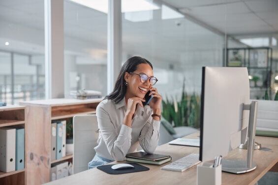 Woman sitting at a computer and evaluating if she her economic development website is outdated