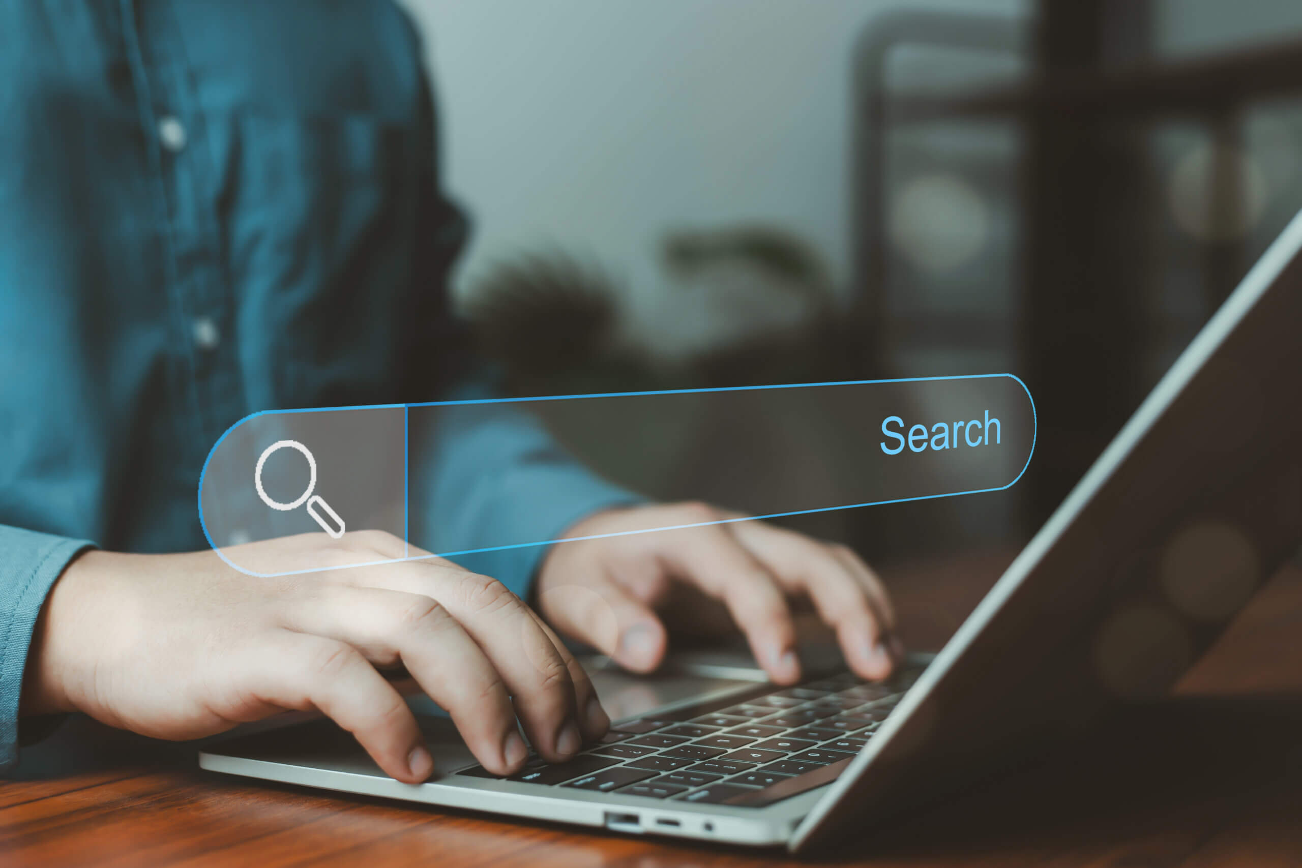 Business user typing on laptop with virtual search bar interface, online search engine concept, information retrieval, SEO optimization, data browsing and digital technology for modern internet usage