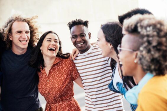 Happy people having fun outside and enjoying life