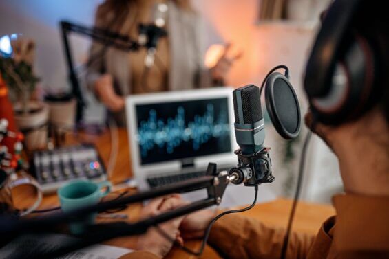 a young man recording a live broadcast in studio